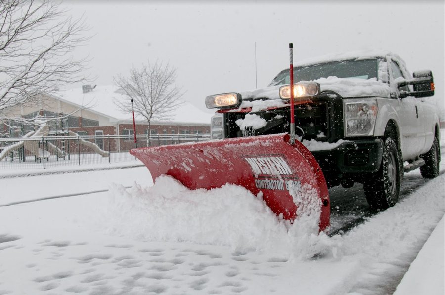 Example of a pickup truck with a snow plow during winter clearing